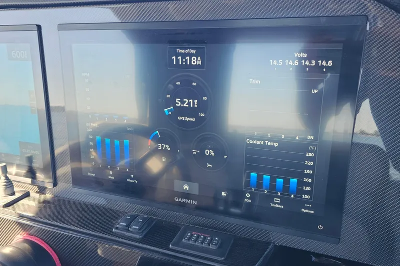  Yacht Photos Pics Dashboard of 2025 Nor-Tech 390 Sport Center Console with Garmin display showing GPS speed and engine data.