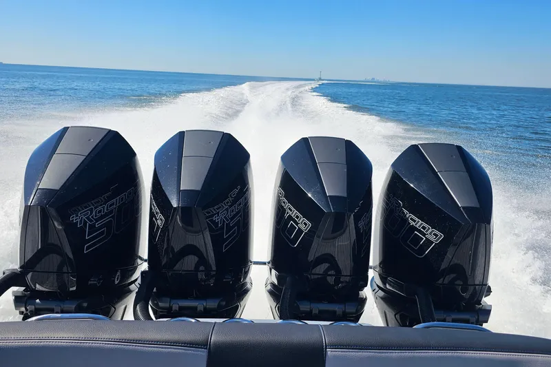  Yacht Photos Pics 2025 Nor-Tech 390 Sport Center Console with four powerful outboard engines on open water.