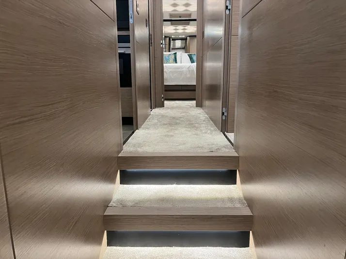  Yacht Photos Pics Interior of 2018 Ferretti Yachts 780, featuring elegant wooden stairs and modern design.
