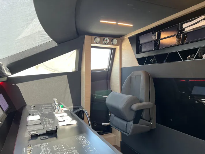  Yacht Photos Pics Interior helm of 2018 Ferretti Yachts 780, featuring modern controls and seating.
