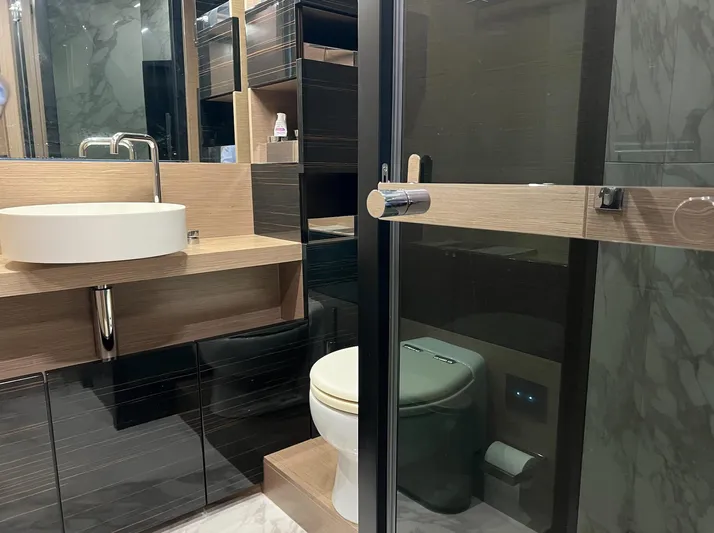  Yacht Photos Pics Luxurious bathroom in 2018 Ferretti Yachts 780, featuring modern sink and shower.