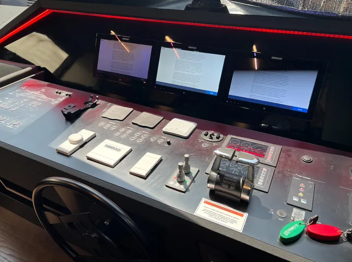  Yacht Photos Pics Control panel of a 2018 Ferretti Yachts 780 with multiple screens and navigation controls.