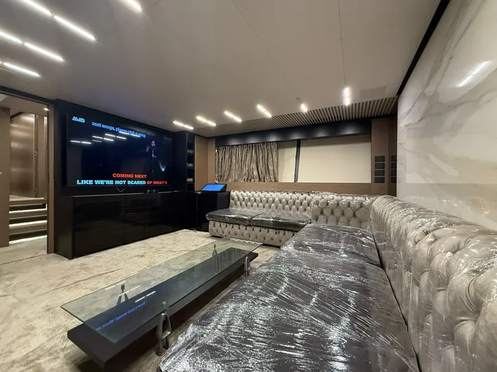  Yacht Photos Pics Luxurious interior of 2018 Ferretti Yachts 780 with plush seating and large TV screen.