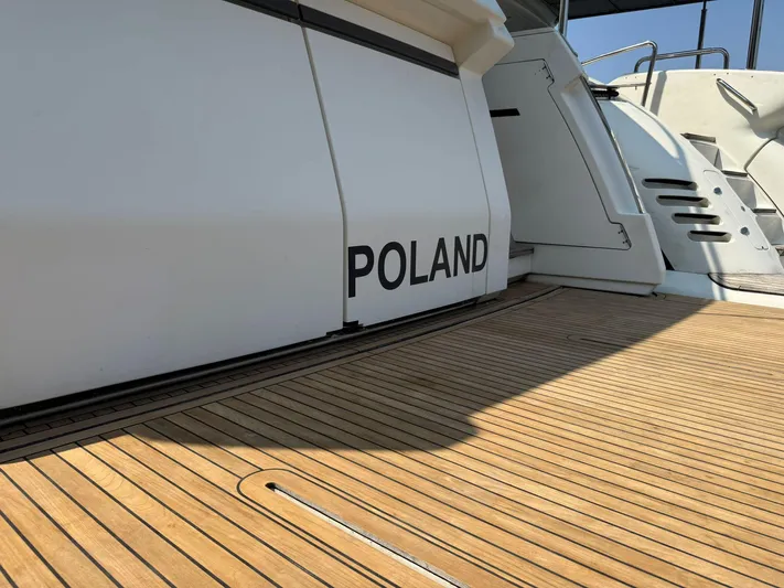  Yacht Photos Pics 2018 Ferretti Yachts 780 deck with "Poland" inscription, featuring sleek design and wood finish.