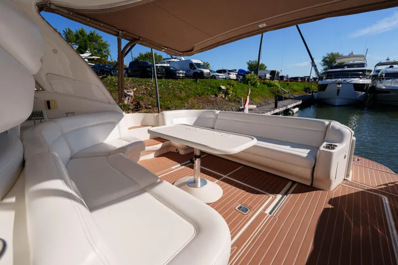  Yacht Photos Pics Luxurious 2004 Sea Ray Sundancer 460 yacht interior with white seating and table.