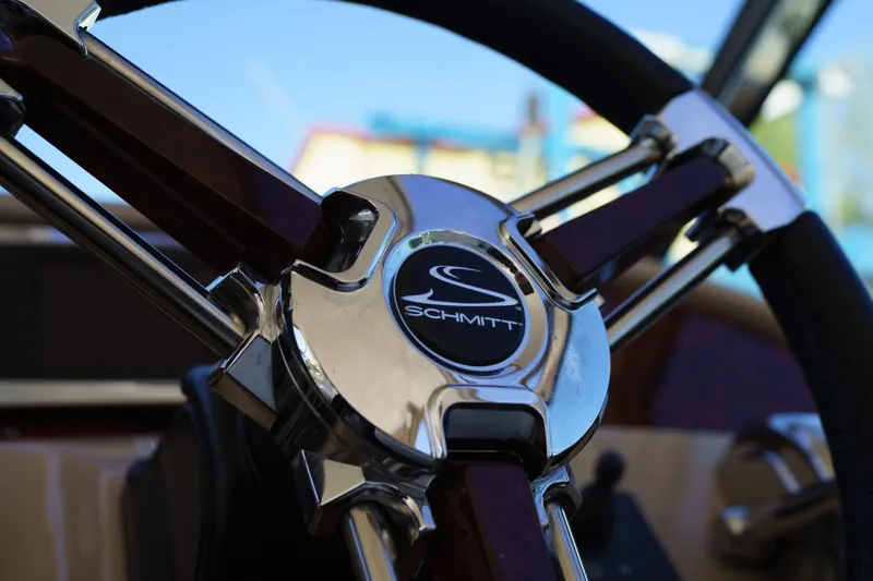  Yacht Photos Pics Steering wheel of a 2004 Sea Ray Sundancer 460 boat, featuring Schmitt logo.