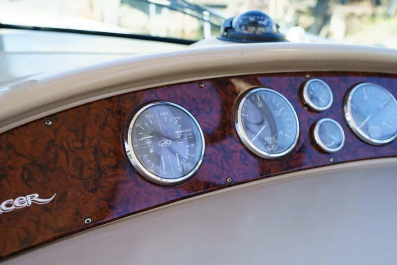  Yacht Photos Pics Dashboard of 2004 Sea Ray Sundancer 460 with wood paneling and gauges.