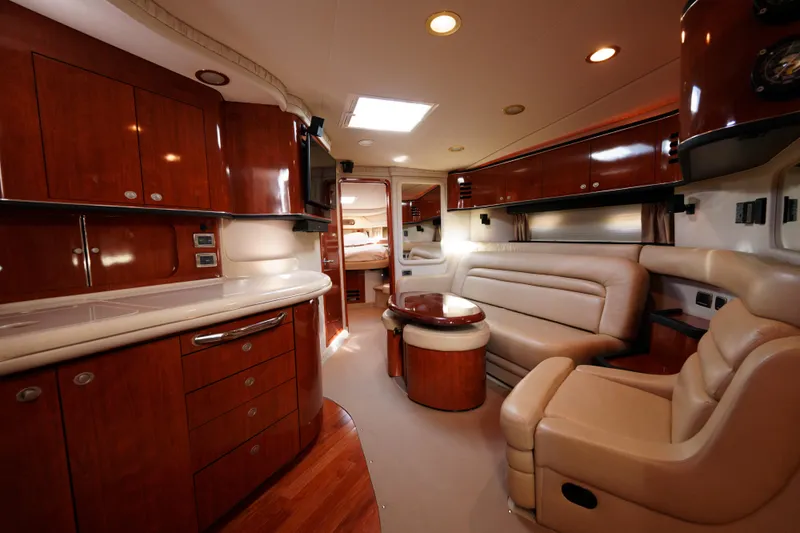  Yacht Photos Pics Luxurious 2004 Sea Ray Sundancer 460 yacht interior with elegant wood cabinetry and plush seating.