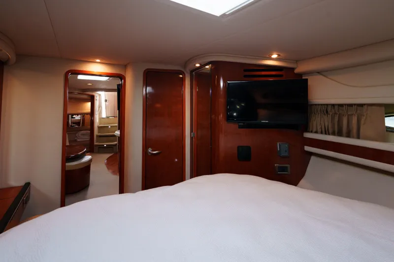  Yacht Photos Pics Interior of 2004 Sea Ray Sundancer 460 yacht with wood paneling and TV.