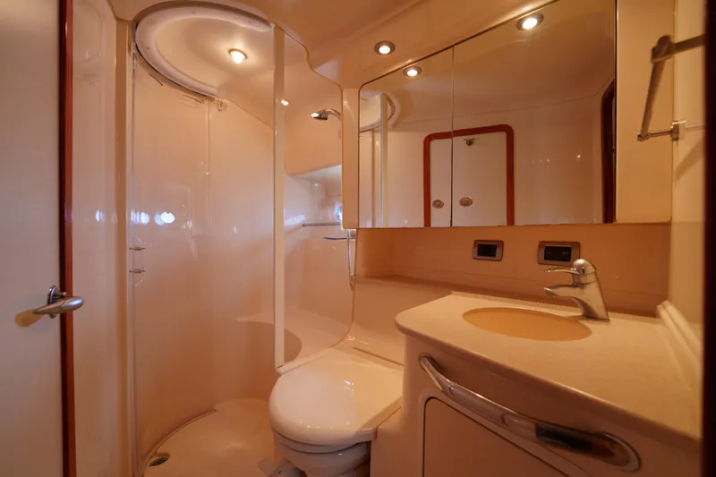  Yacht Photos Pics Luxurious bathroom interior of 2004 Sea Ray Sundancer 460 yacht with modern fixtures.