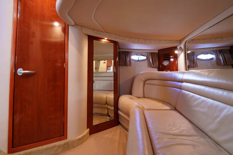 Yacht Photos Pics Luxurious interior of 2004 Sea Ray Sundancer 460 yacht with leather seating and wooden accents.