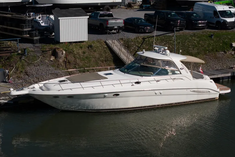  Yacht Photos Pics 2004 Sea Ray Sundancer 460 yacht docked at marina, side view.