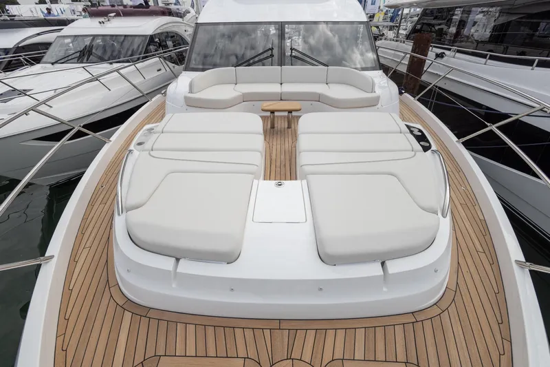  Yacht Photos Pics Luxurious 2024 Princess F65 yacht with spacious deck and elegant seating area.