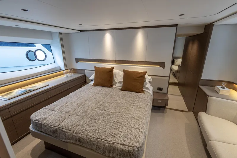  Yacht Photos Pics Luxurious 2024 Princess F65 yacht bedroom with modern design and elegant furnishings.