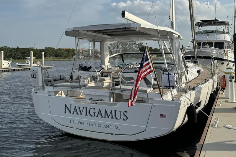 Navigamus Yacht Photos Pics 2023 Hanse 460 yacht docked, displaying American flag, Hilton Head Island, SC.