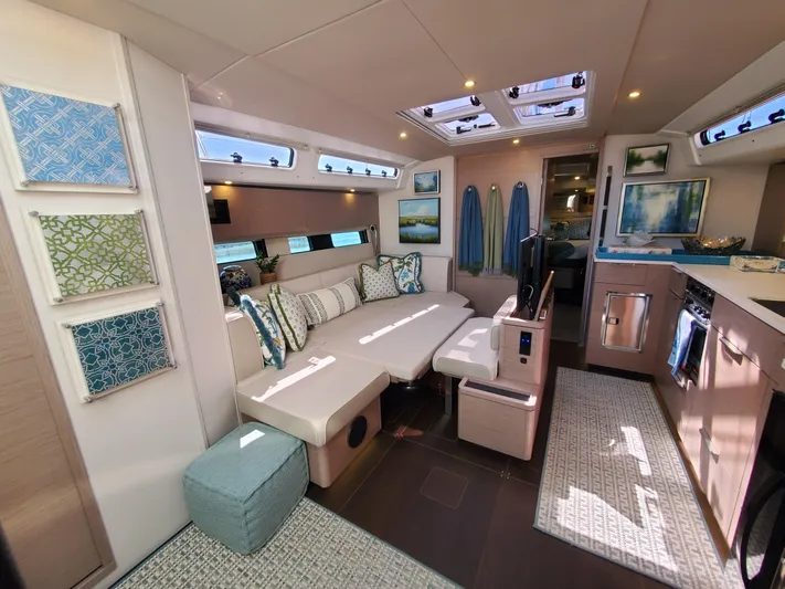 Navigamus Yacht Photos Pics Luxurious interior of 2023 Hanse 460 yacht with modern decor and ample natural light.