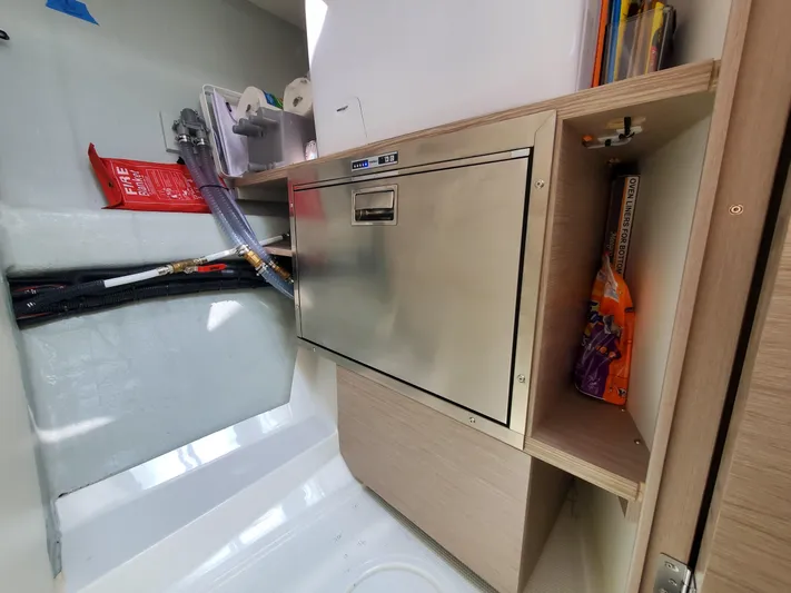 Navigamus Yacht Photos Pics 2023 Hanse 460 yacht interior with stainless steel storage and organized compartments.