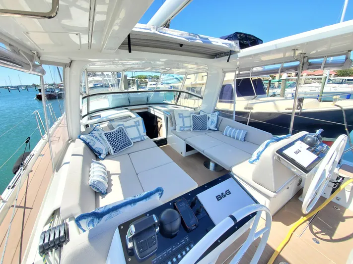 Navigamus Yacht Photos Pics Luxurious 2023 Hanse 460 yacht interior with plush seating and nautical decor.