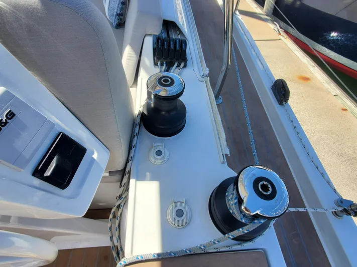 Navigamus Yacht Photos Pics Deck view of 2023 Hanse 460 sailboat, featuring winches and seating area.