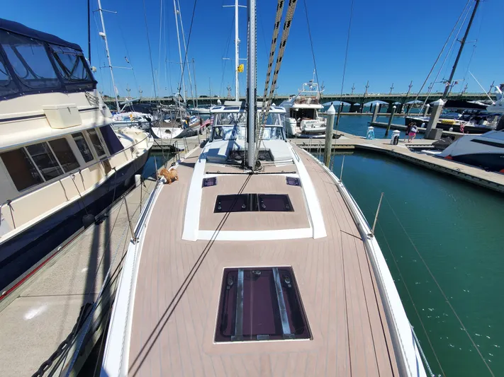 Navigamus Yacht Photos Pics 2023 Hanse 460 yacht docked at marina, showcasing sleek deck design and modern features.