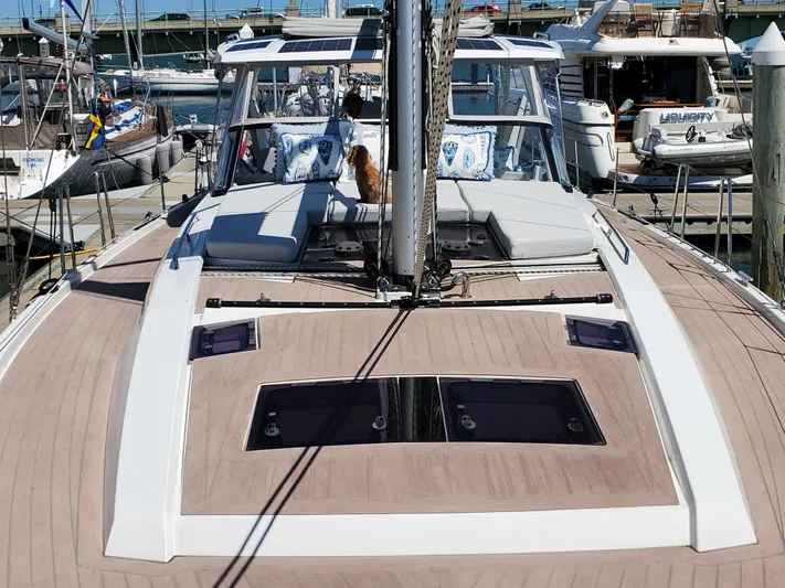 Navigamus Yacht Photos Pics 2023 Hanse 460 yacht docked at marina, featuring spacious deck and modern design.