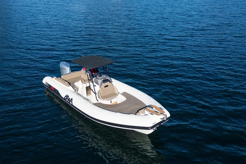  Yacht Photos Pics 2026 BWA GTO 308 boat on calm blue water, featuring sleek design and modern amenities.