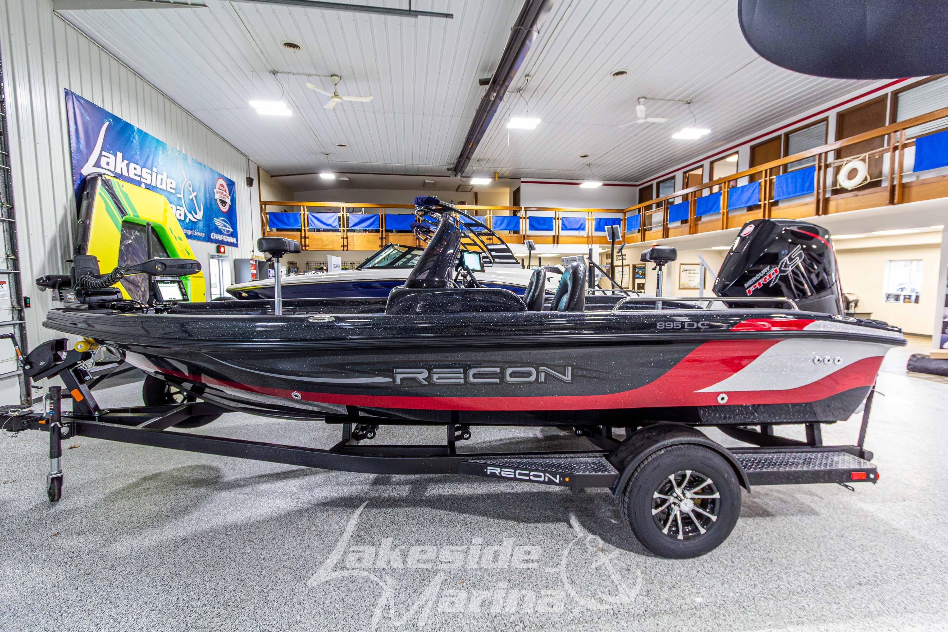 2026 Recon 895 DC boat in showroom, featuring sleek design and modern features.