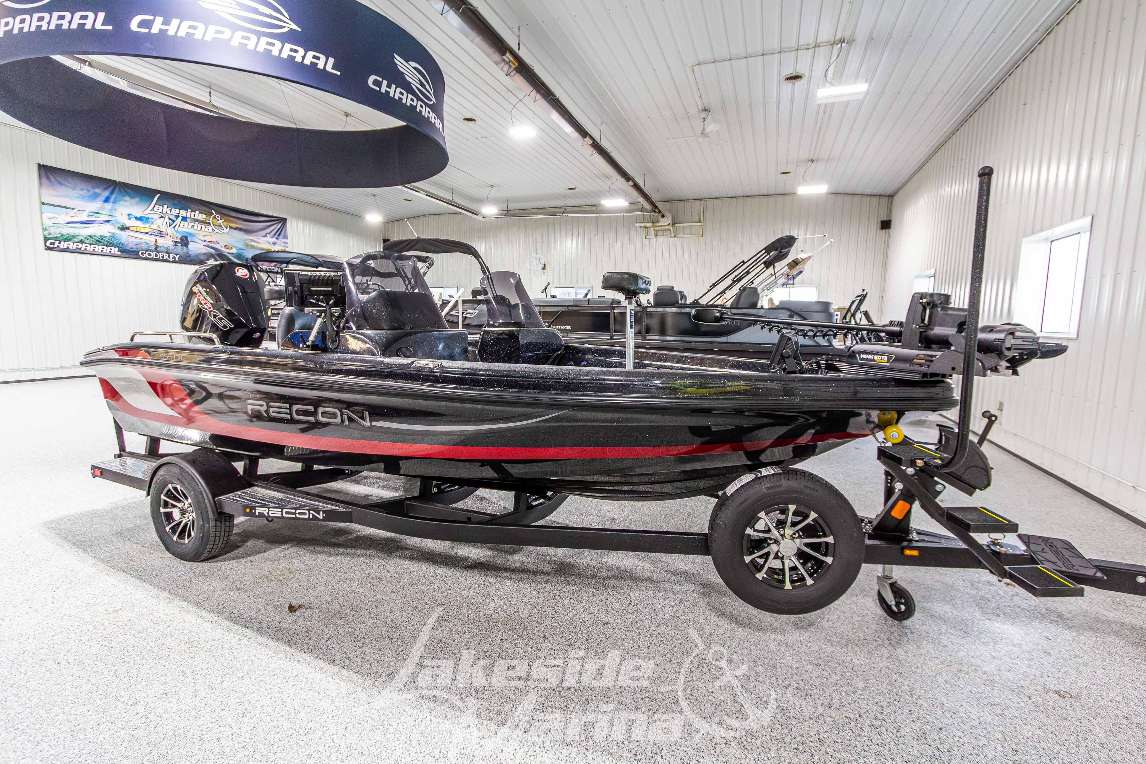 2026 Recon 895 DC boat displayed indoors on a trailer.