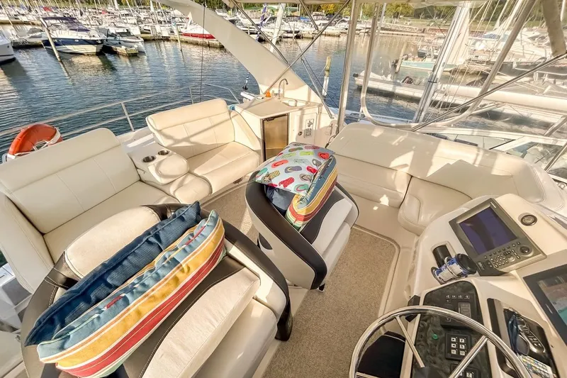  Yacht Photos Pics Luxurious 2003 Silverton 410 Sport Bridge interior with plush seating and modern controls.