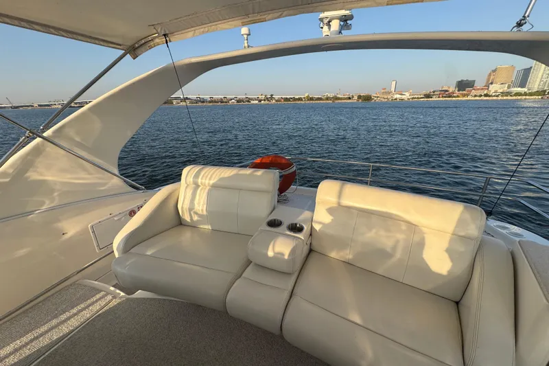  Yacht Photos Pics Luxurious seating on 2003 Silverton 410 Sport Bridge yacht with waterfront city view.