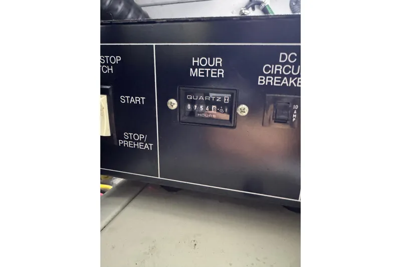  Yacht Photos Pics Control panel of a 2003 Silverton 410 Sport Bridge with hour meter and circuit breaker.