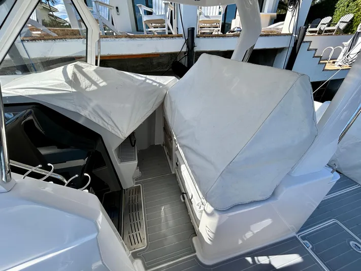 All Gas No Brakes Yacht Photos Pics 2020 Regal 33 SAV boat interior with covered seating and helm area.