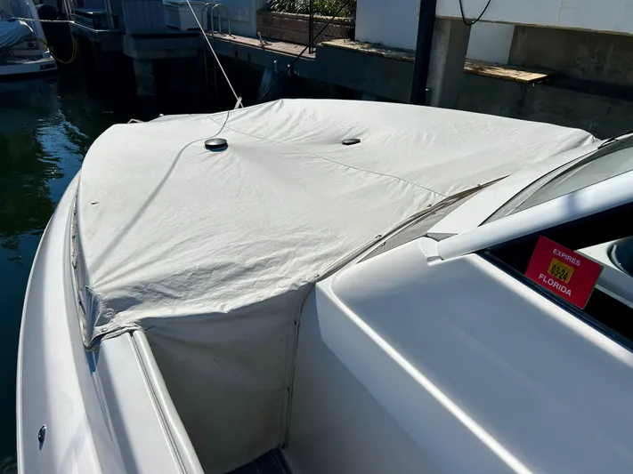 All Gas No Brakes Yacht Photos Pics 2020 Regal 33 SAV boat with cover docked in marina.