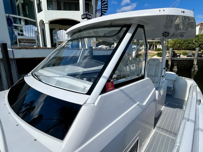 All Gas No Brakes Yacht Photos Pics 2020 Regal 33 SAV boat docked, featuring sleek design and spacious deck.