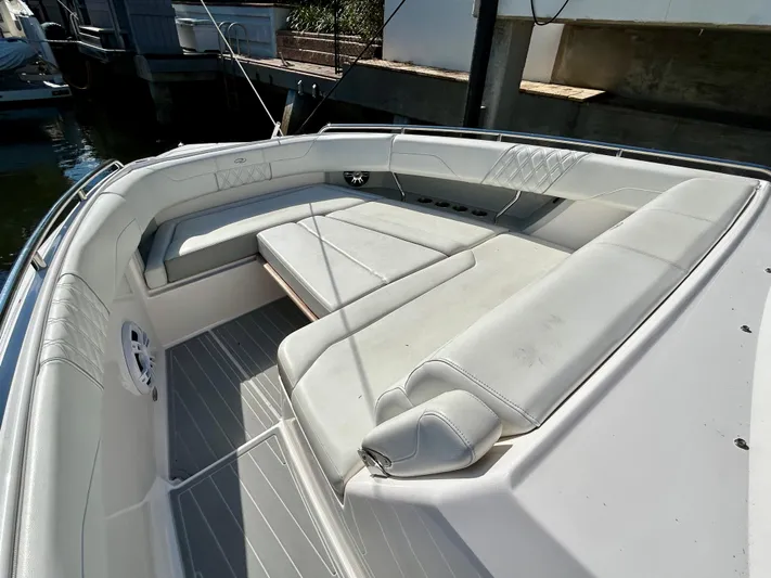 All Gas No Brakes Yacht Photos Pics 2020 Regal 33 SAV boat with spacious white seating area.