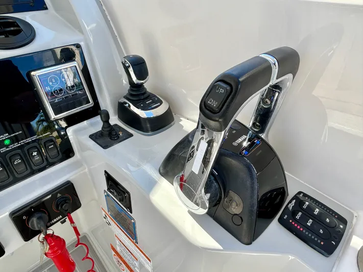 All Gas No Brakes Yacht Photos Pics Control panel of 2020 Regal 33 SAV boat with throttle and joystick.
