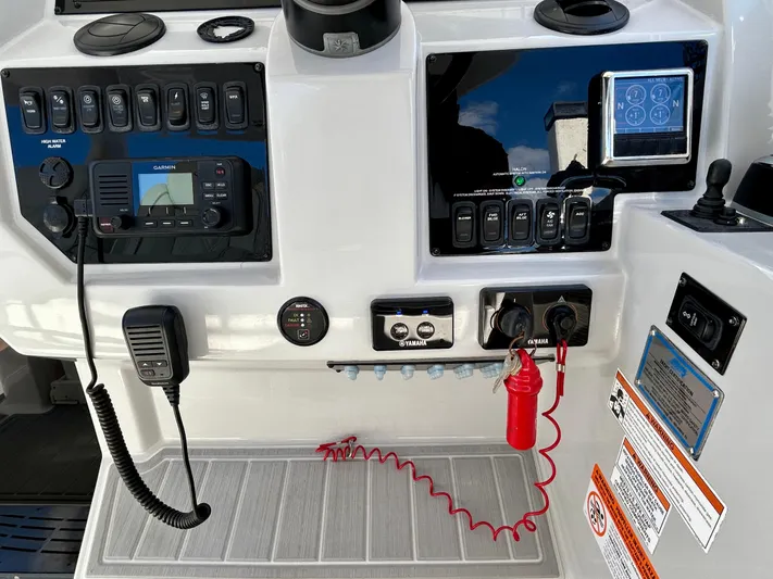 All Gas No Brakes Yacht Photos Pics Control panel of a 2020 Regal 33 SAV boat with navigation and communication equipment.