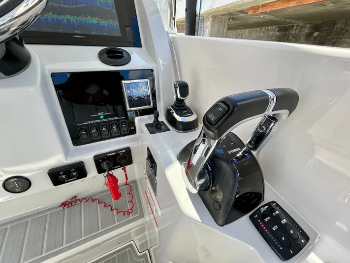 All Gas No Brakes Yacht Photos Pics Control panel of 2020 Regal 33 SAV boat with throttle and navigation display.