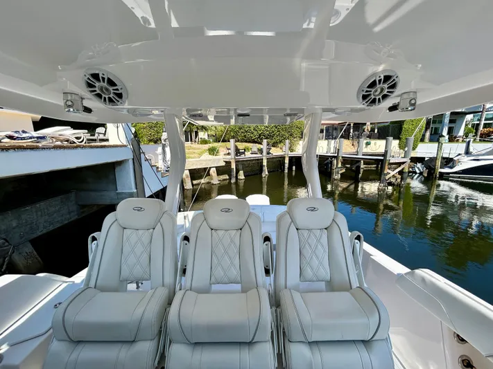 All Gas No Brakes Yacht Photos Pics 2020 Regal 33 SAV boat interior with luxurious seating and waterfront view.