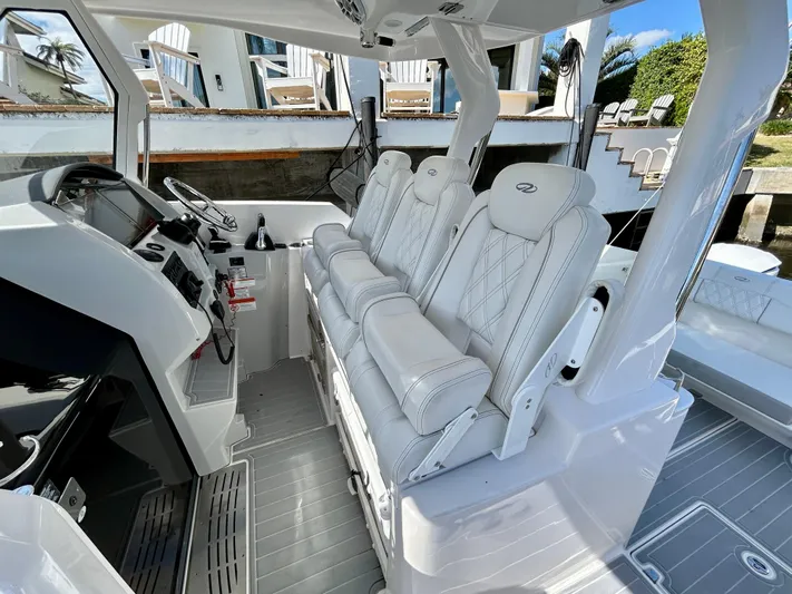All Gas No Brakes Yacht Photos Pics 2020 Regal 33 SAV boat interior with white leather seats and modern dashboard.