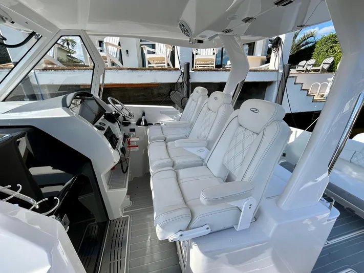 All Gas No Brakes Yacht Photos Pics Interior of 2020 Regal 33 SAV boat with luxurious white seating and modern dashboard.