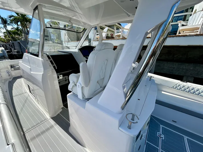 All Gas No Brakes Yacht Photos Pics 2020 Regal 33 SAV boat interior with white seating and modern design.
