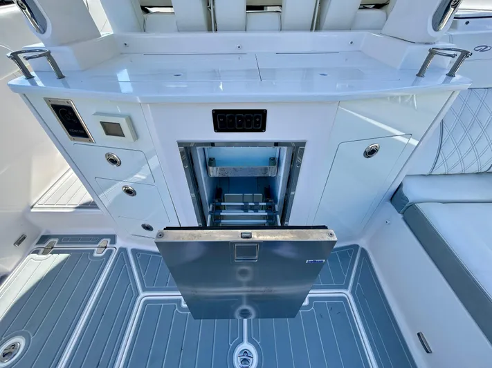 All Gas No Brakes Yacht Photos Pics 2020 Regal 33 SAV boat interior with modern kitchen amenities and sleek design.