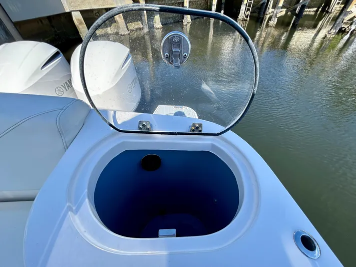 All Gas No Brakes Yacht Photos Pics 2020 Regal 33 SAV boat with open hatch near water.