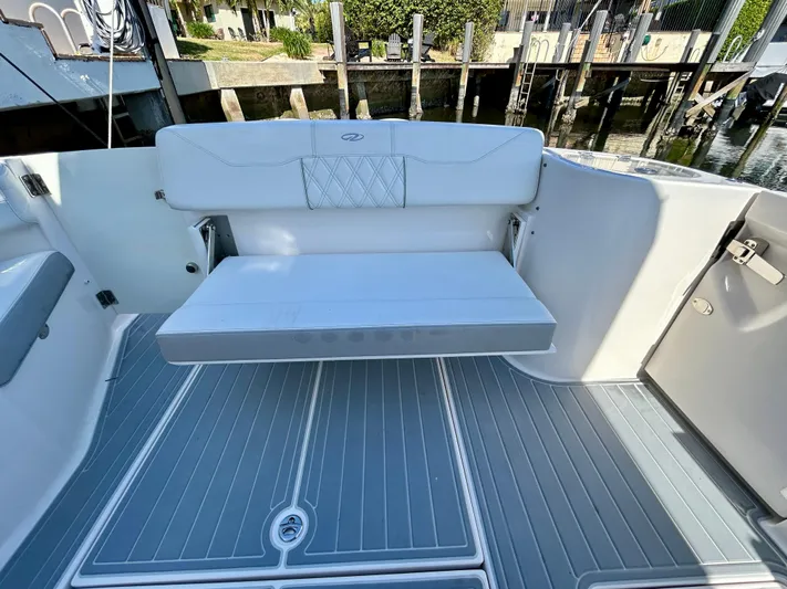 All Gas No Brakes Yacht Photos Pics 2020 Regal 33 SAV boat interior with white seating and gray flooring.