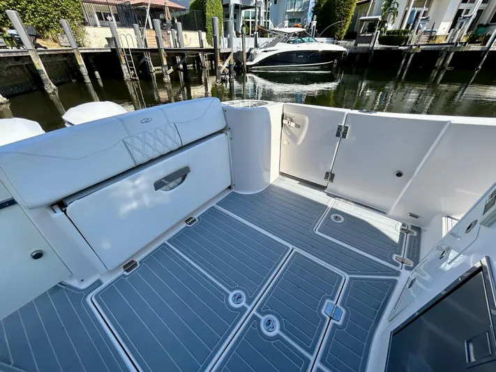 All Gas No Brakes Yacht Photos Pics 2020 Regal 33 SAV boat interior with sleek deck design and waterfront view.