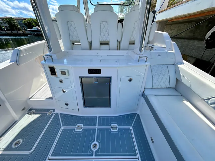 All Gas No Brakes Yacht Photos Pics 2020 Regal 33 SAV boat interior with white seating and modern amenities.