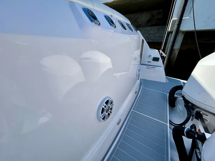 All Gas No Brakes Yacht Photos Pics 2020 Regal 33 SAV boat deck with sleek white finish and modern design.