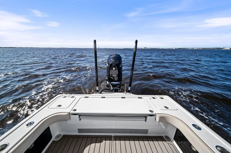  Yacht Photos Pics 2021 Barker Boatworks 26 Open on water, showcasing rear deck and motor.