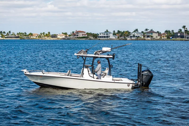  Yacht Photos Pics 2021 Barker Boatworks 26 Open on water, with scenic coastal background.
